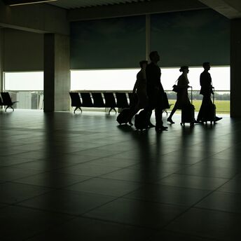 cabin crew walking through an airport