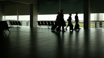 cabin crew walking through an airport