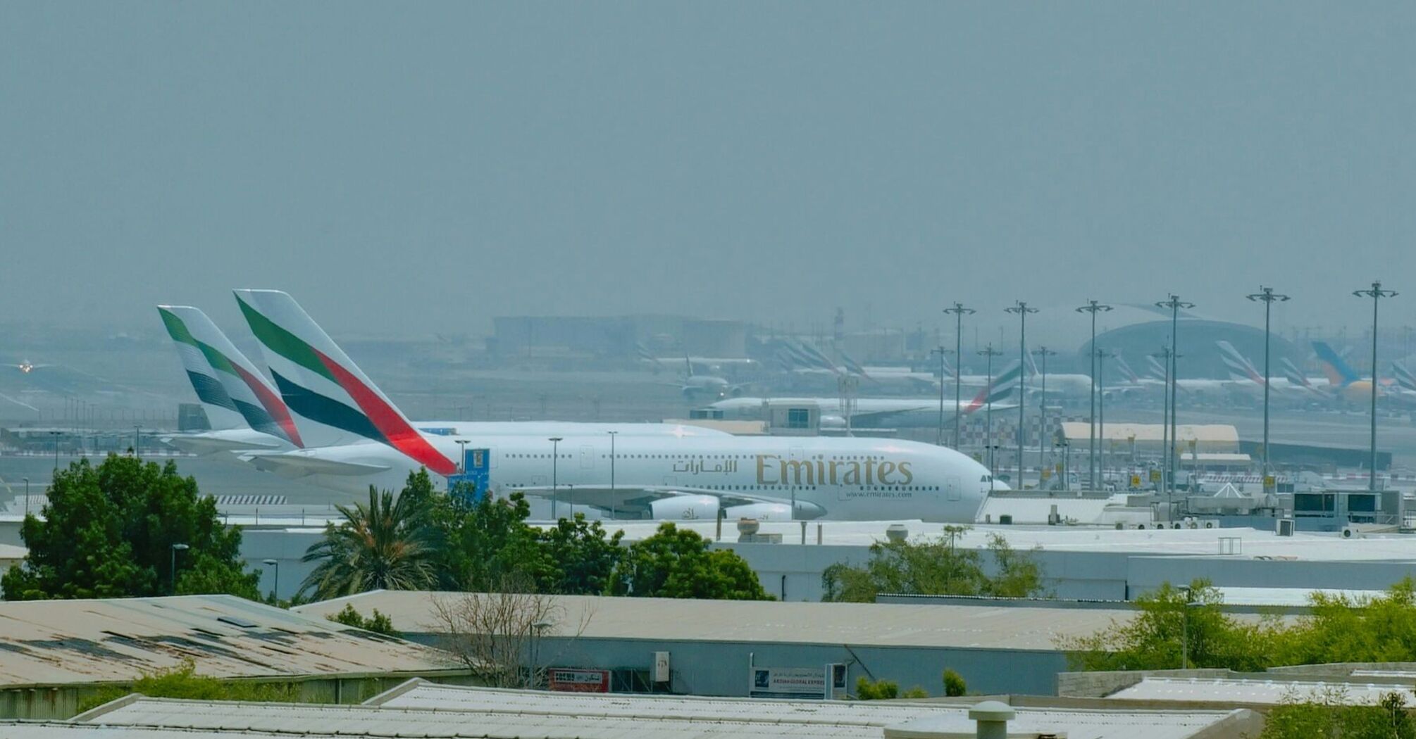 large jetliners sitting on top of an airport tarmac