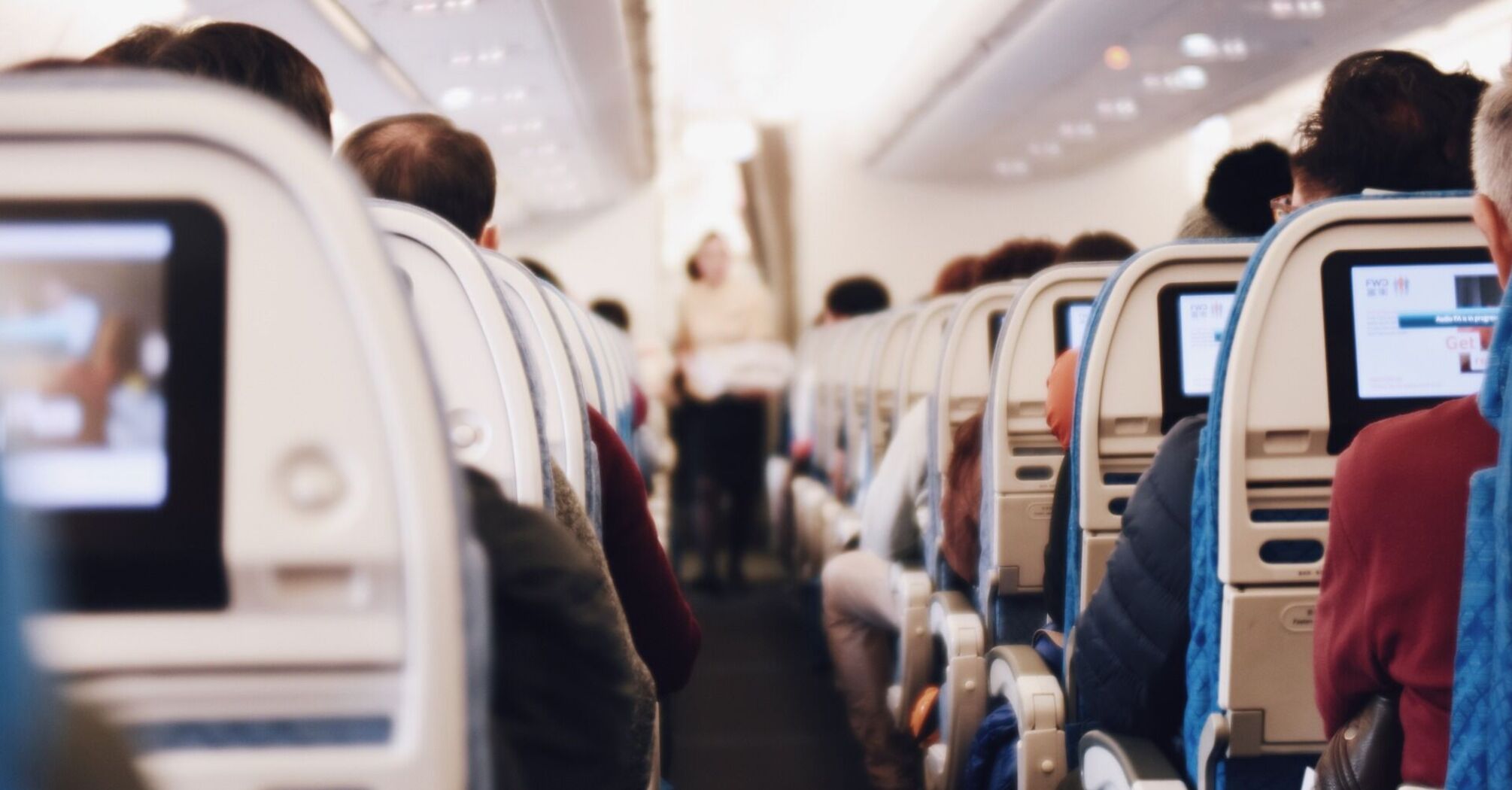 Passengers sitting in an airplane cabin