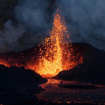Molten lava erupts from a fissure on the Reykjanes Peninsula in Iceland