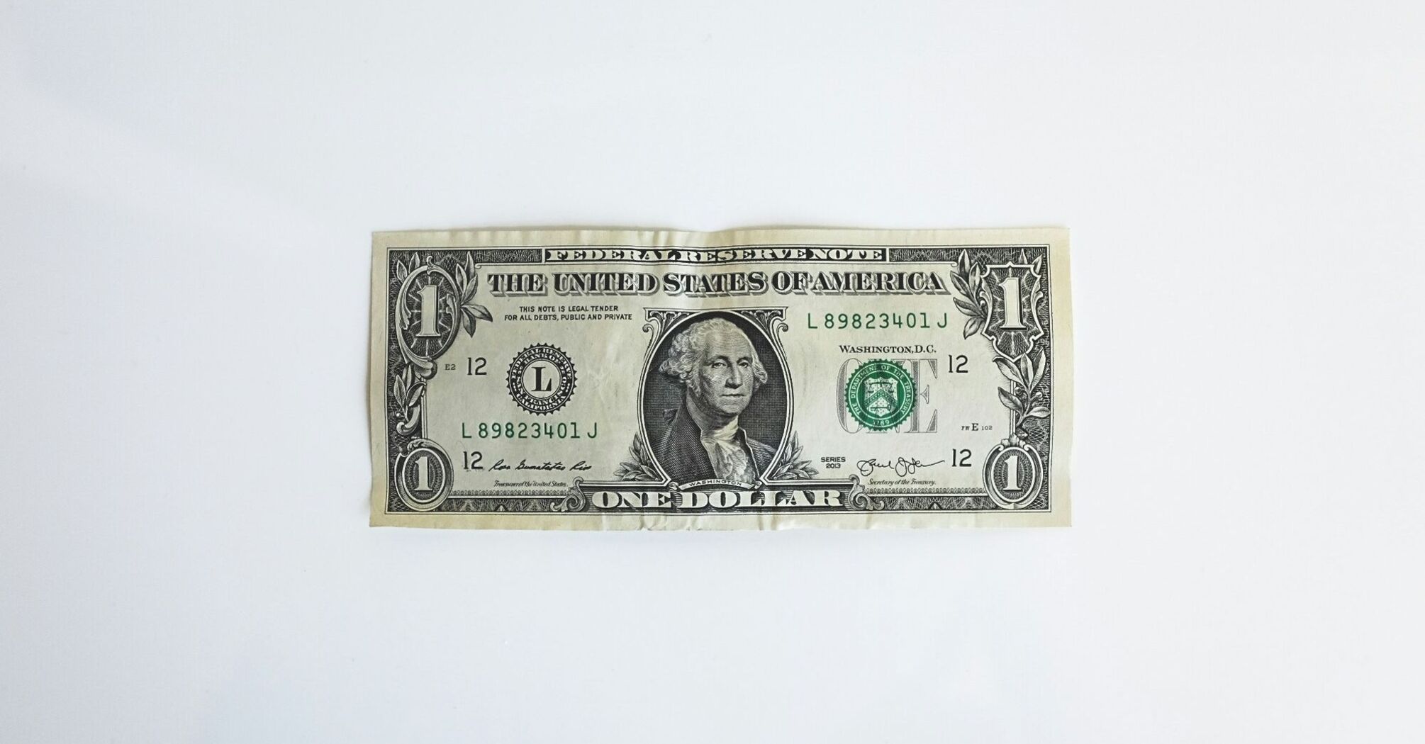 One dollar bill on a white background