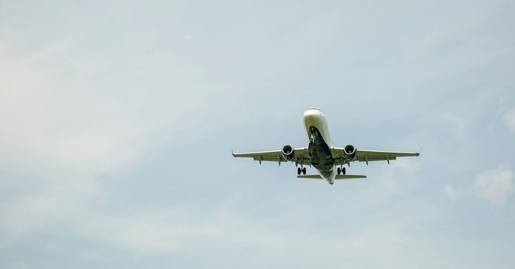 Airplane taking off against a clear sky