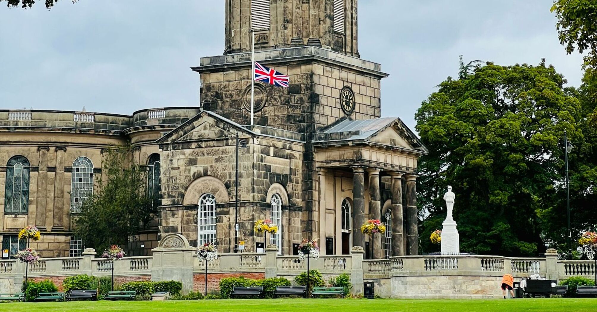 A historic stone building in Shrewsbury with a domed tower