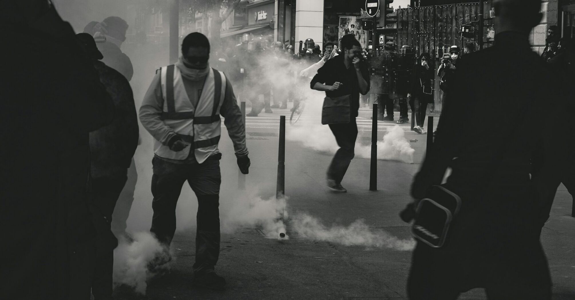 Protesters and police clash in city street