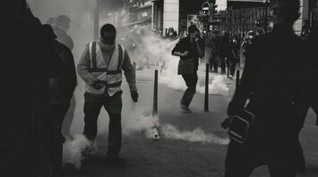 Protesters and police clash in city street