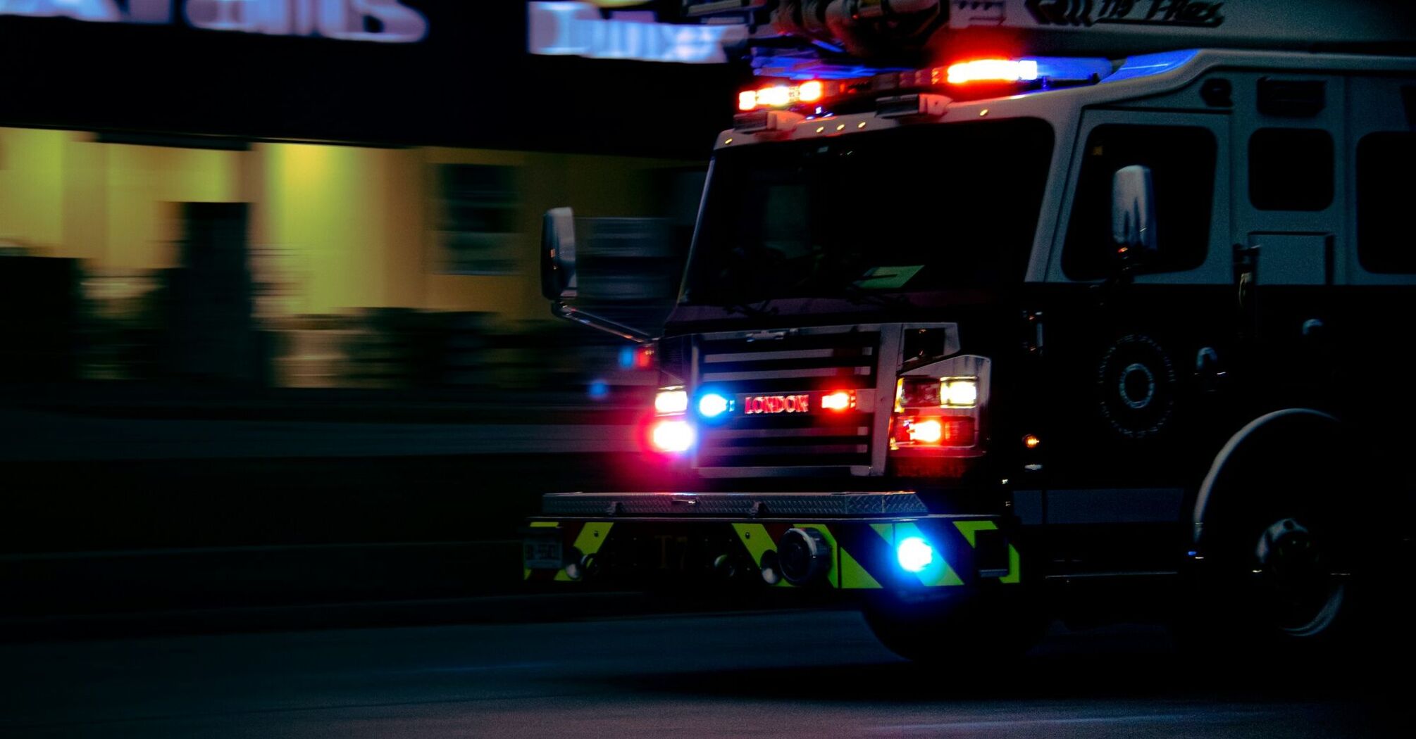 Fire truck with flashing lights at night