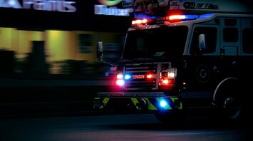 Fire truck with flashing lights at night