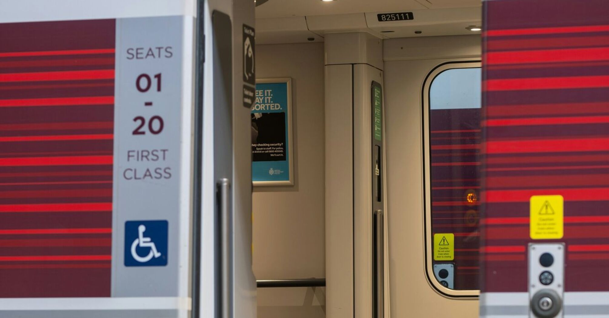 Open door of a LNER train carriage at a station