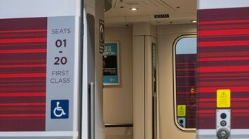 Open door of a LNER train carriage at a station
