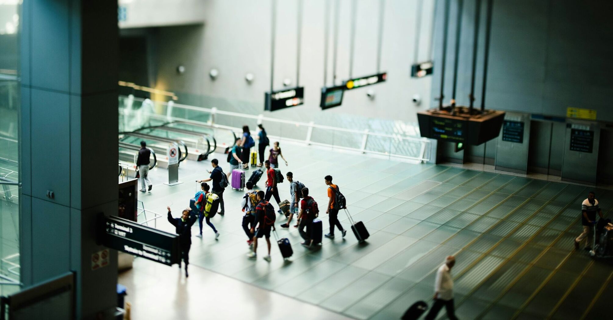 Passengers walking through a modern airport terminal