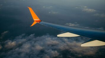 Jeju Air plane flying above the clouds