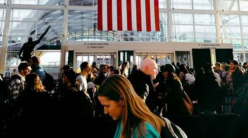 Passengers waiting in line at an airport