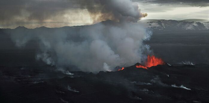 Volcanic eruption with smoke and lava on the Reykjanes Peninsula in Iceland