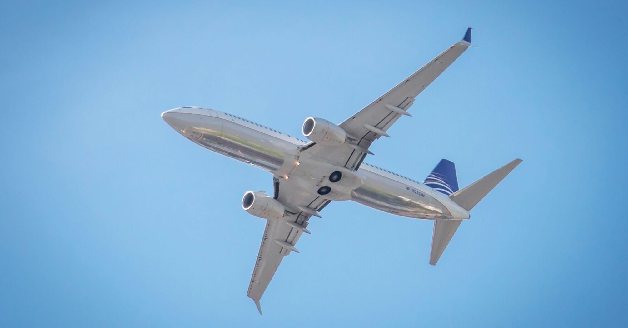 a large passenger jet flying through a blue sky