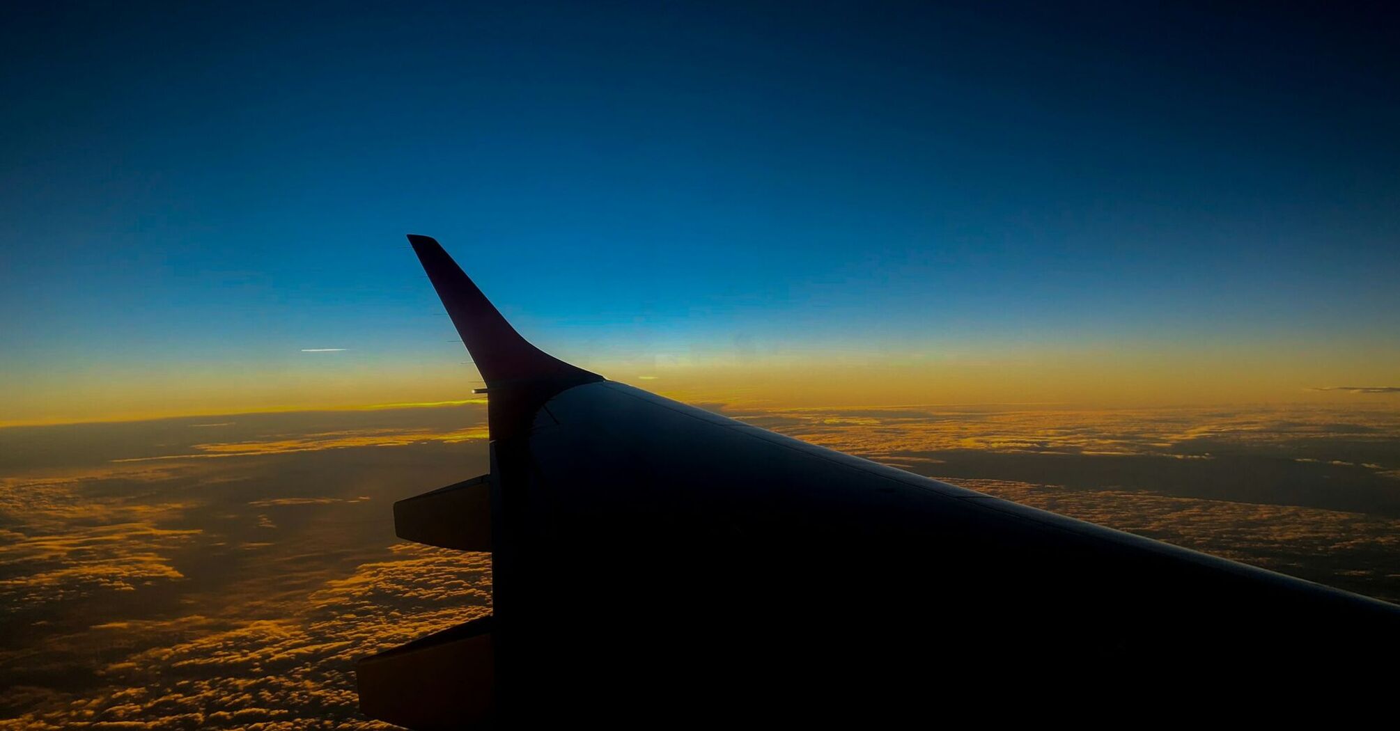 Wing of an airplane during sunset