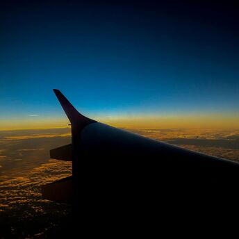 Wing of an airplane during sunset