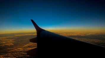 Wing of an airplane during sunset
