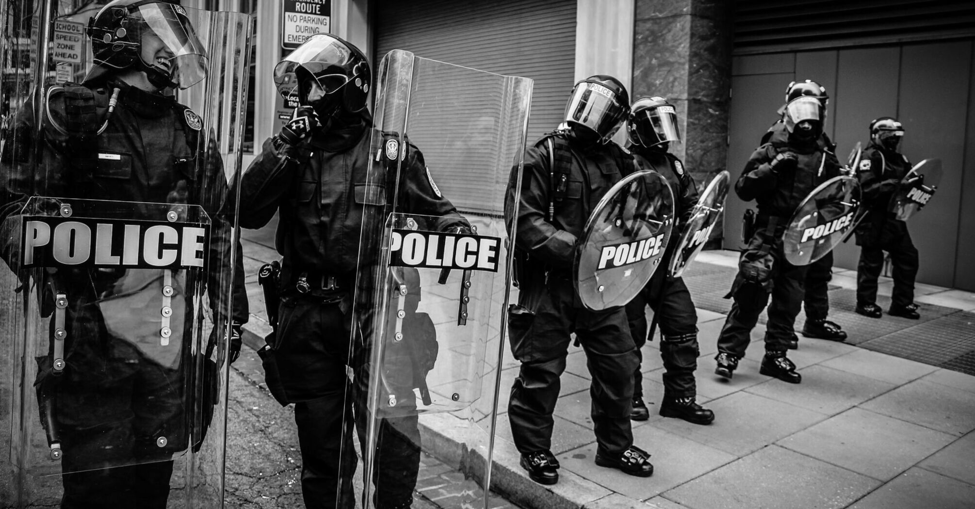 Police officers in riot gear standing in formation