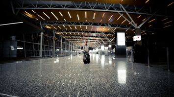 Passenger in an empty Calgary International Airport terminal