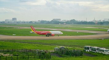 a large jetliner sitting on top of an airport runway
