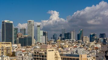 Skyline of Tel Aviv with modern buildings and blue sky