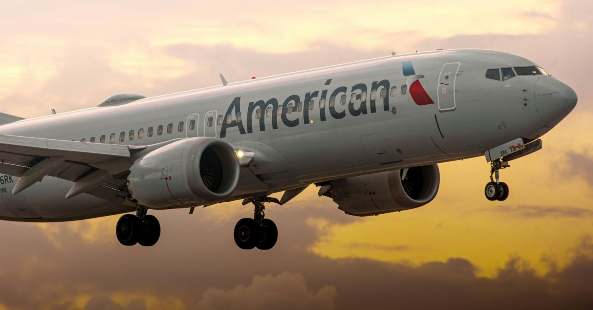 a large passenger jet flying through a cloudy sky