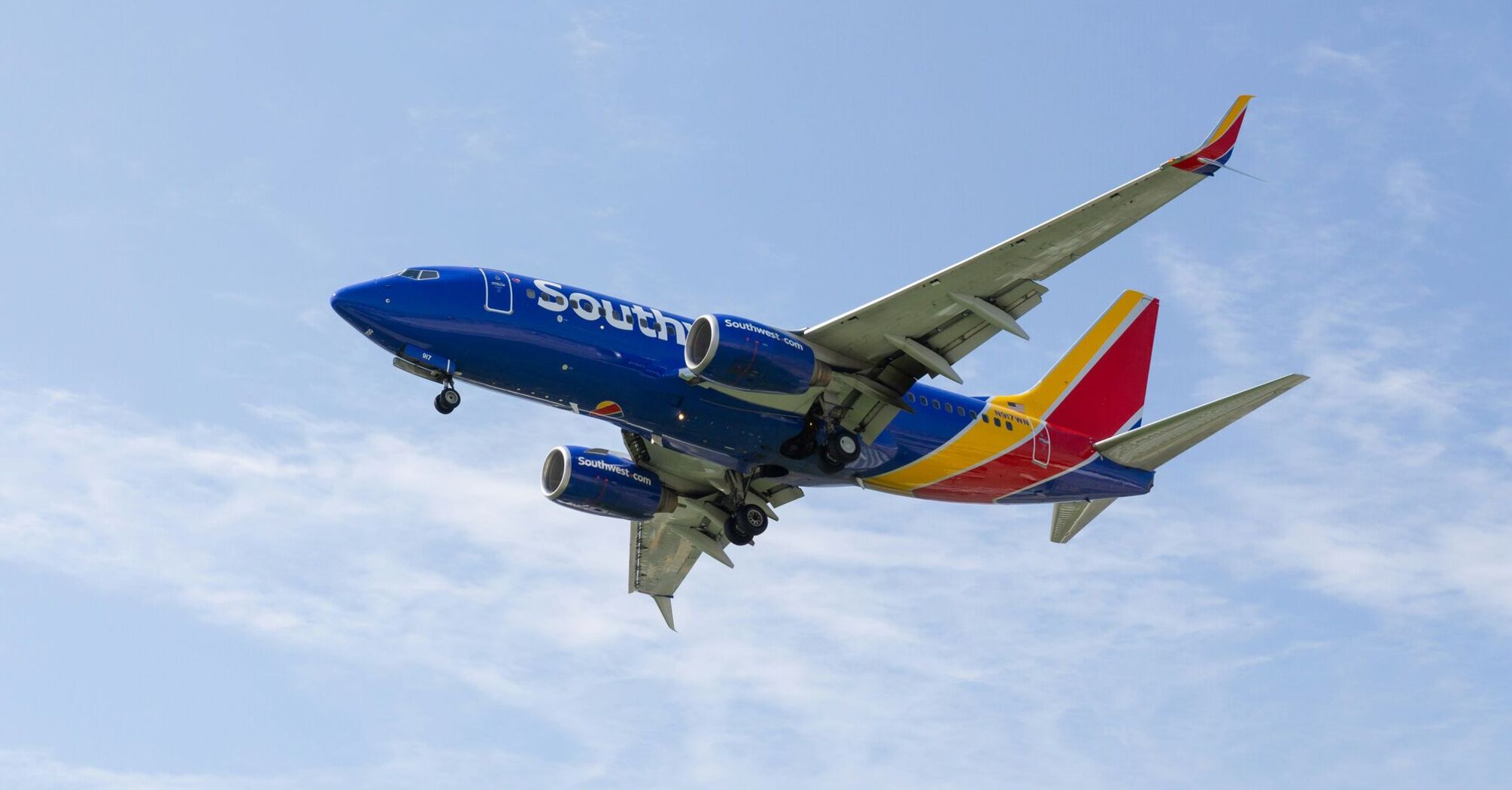 a southwest airlines plane flying in the sky