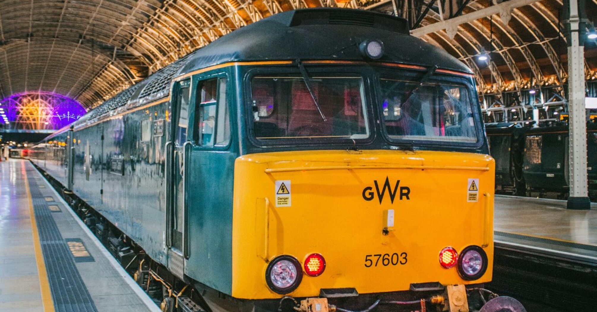 GWR train at a station platform under a vaulted roof