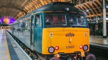 GWR train at a station platform under a vaulted roof
