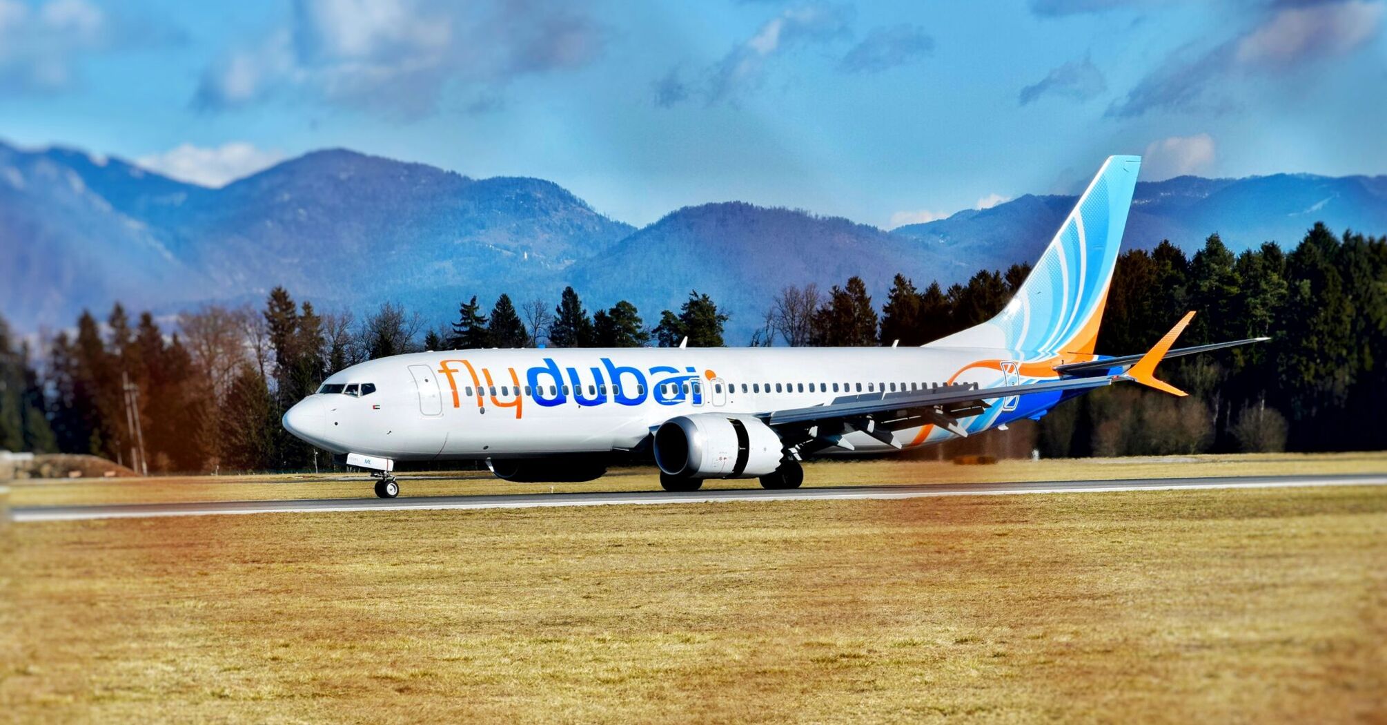 a large jetliner sitting on top of an airport runway