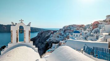 a white church with a cross on top of it