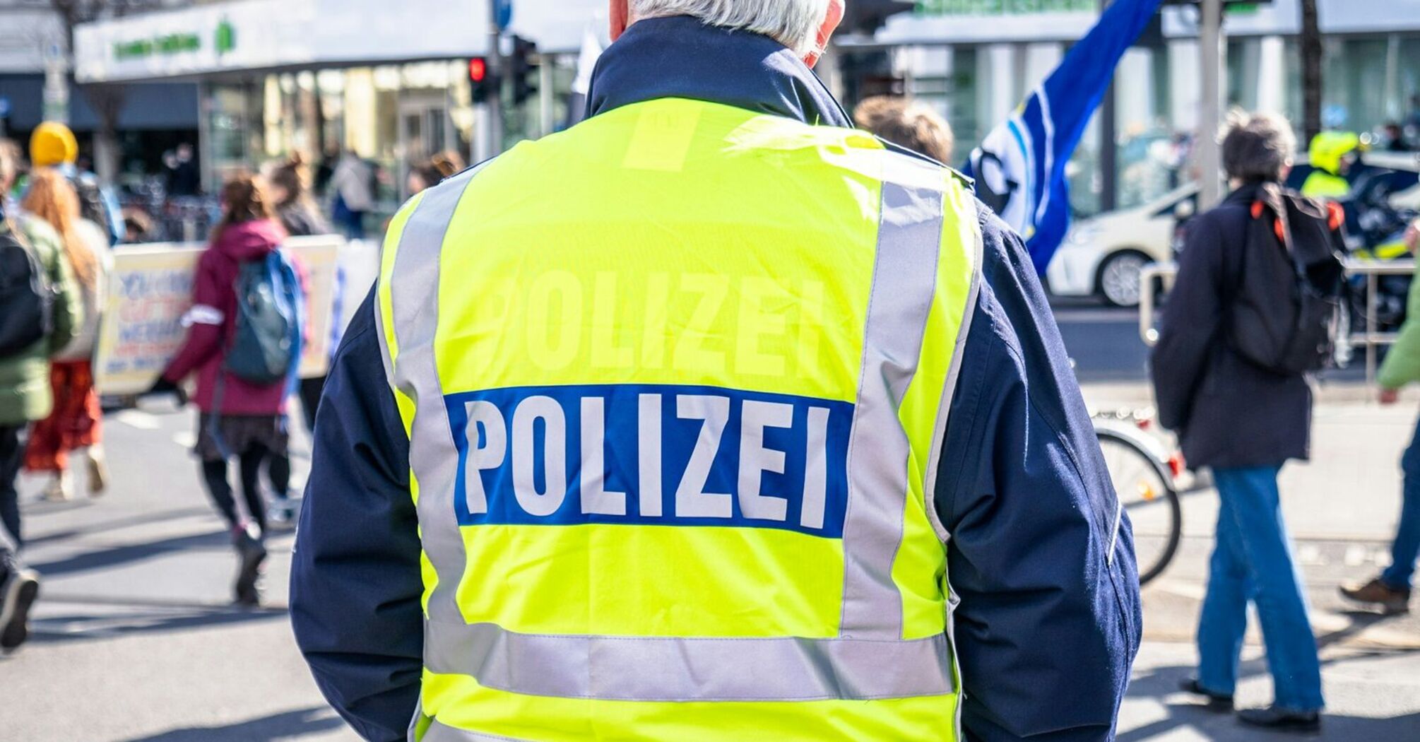 German police officer monitoring a street