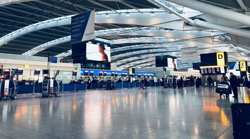 Spacious and modern airport check-in area with self-service kiosks