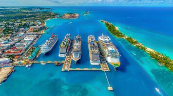 Cruise ships docked at a vibrant tropical port