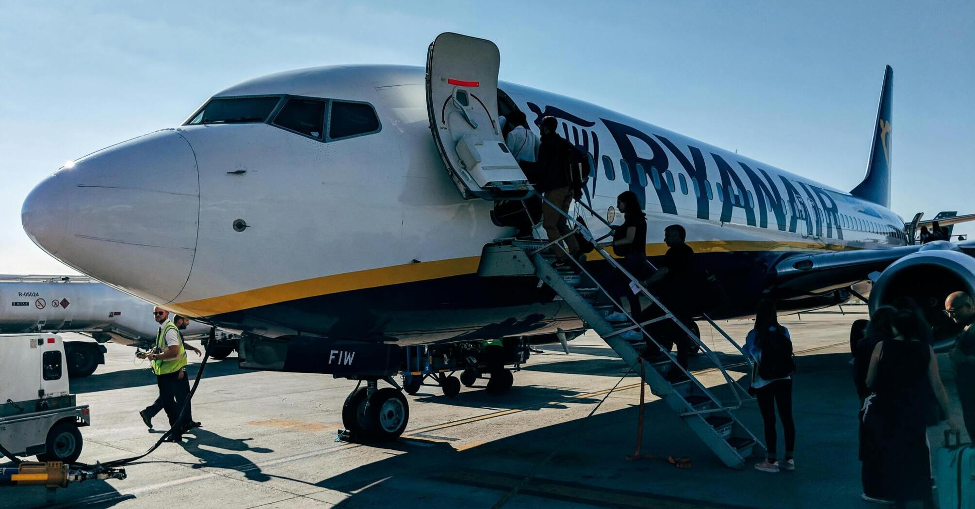 Passengers boarding a Ryanair plane at the airport