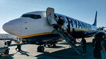 Passengers boarding a Ryanair plane at the airport