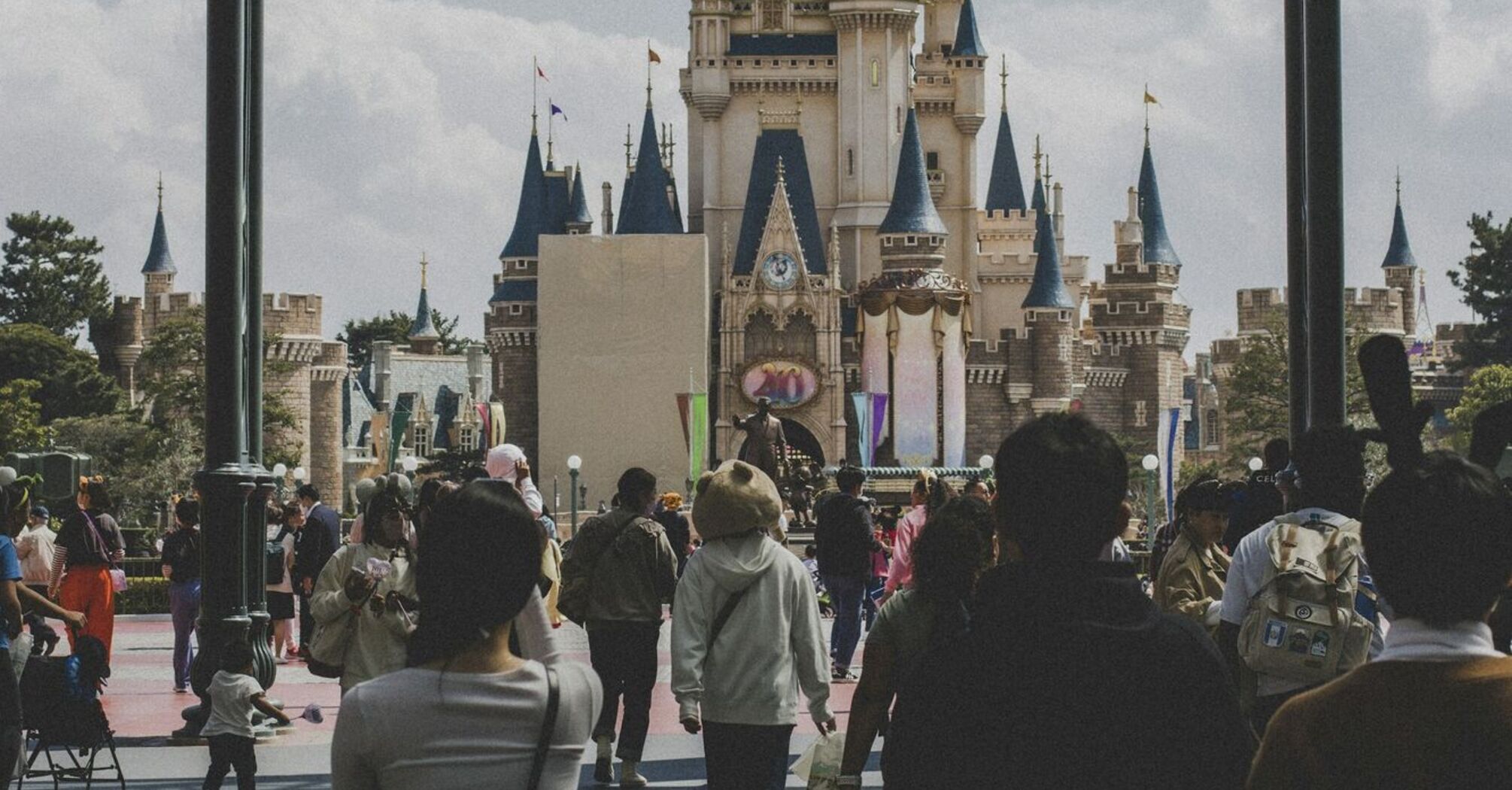 People walking toward a castle in Tokyo Disneyland