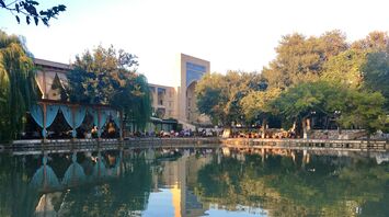 Lyab-i Hauz pond and surrounding trees in Bukhara, Uzbekistan