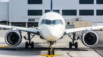 a large jetliner sitting on top of an airport tarmac