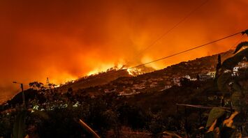 Hills engulfed in wildfire near residential homes