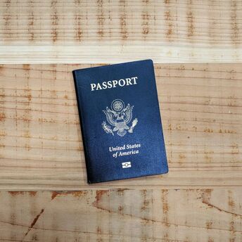U.S. passport lying on a wooden surface