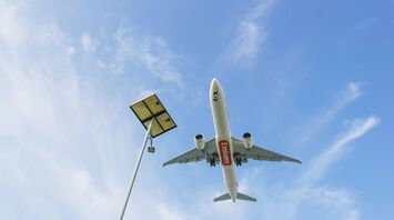 a large jetliner flying through a blue sky