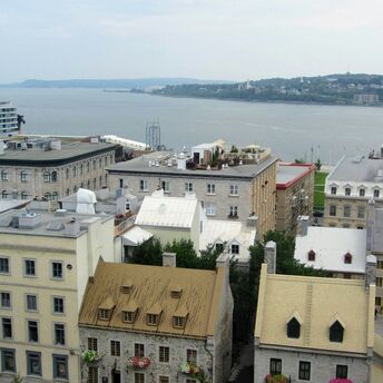 A view of historic buildings near a waterfront in Quebec