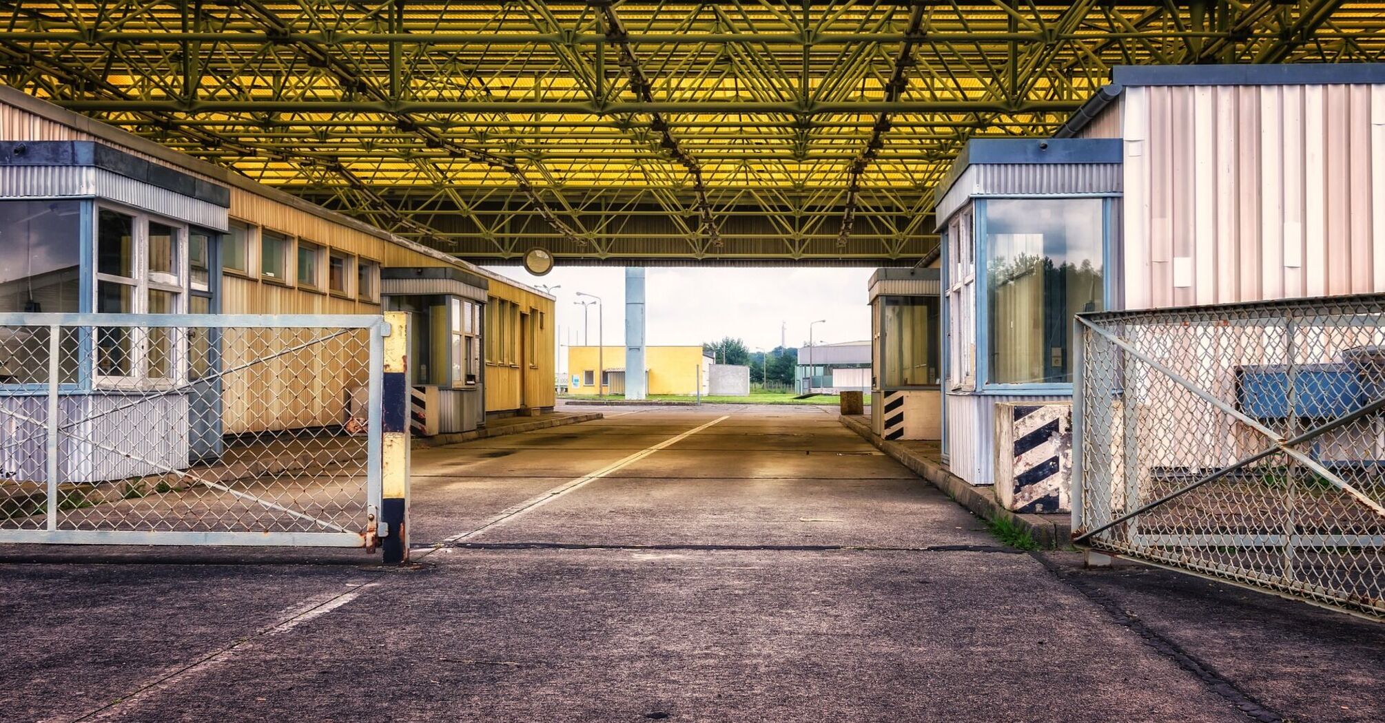 Empty border checkpoint with yellow roof structure