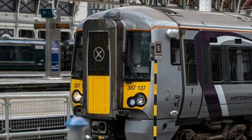 A Heathrow Express train standing at a platform inside a railway station