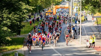 Cyclists participating in a large group event
