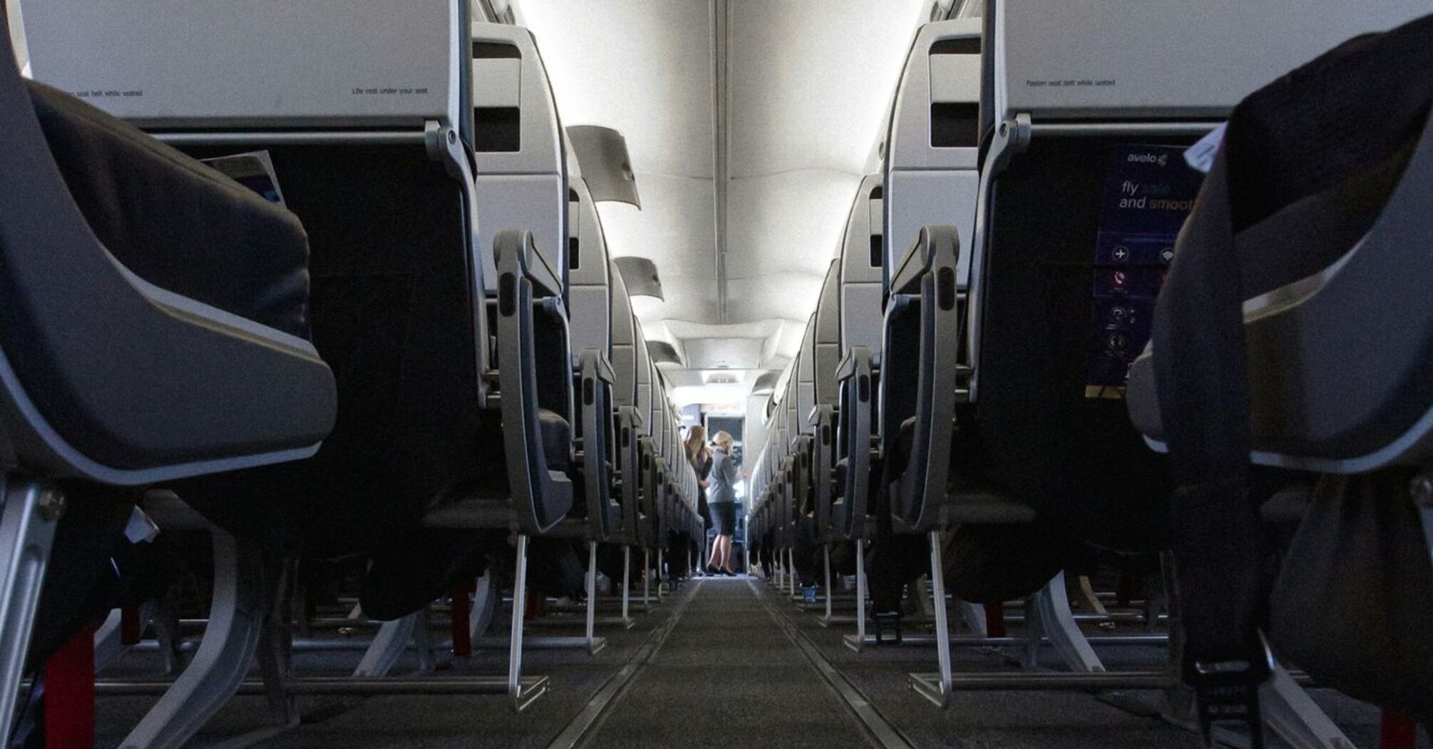 Interior of a Avelo Airlines airplane aisle with rows of seats