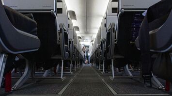 Interior of a Avelo Airlines airplane aisle with rows of seats