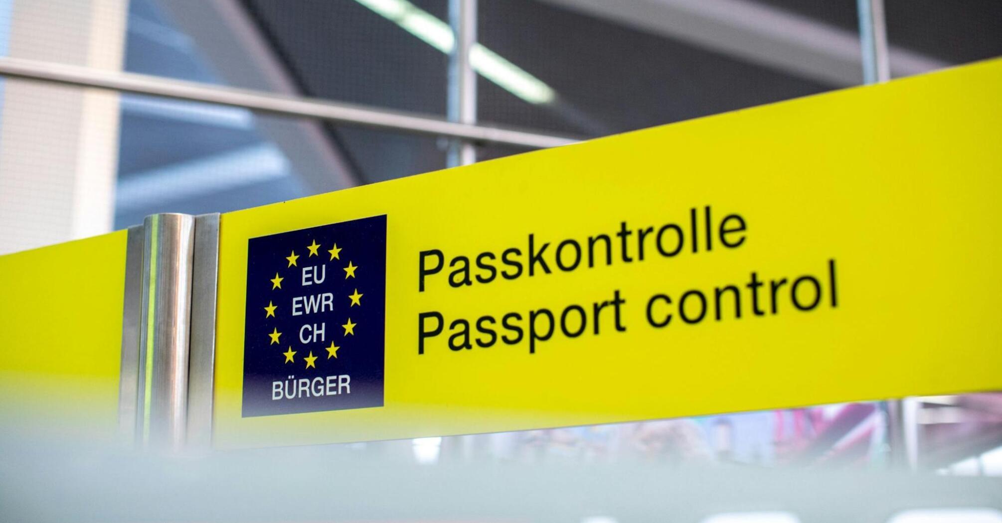 Passport control sign for EU, EWR, and CH citizens at an airport